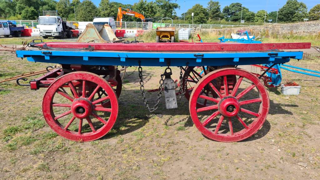 A large dray or four wheeled delivery wagon