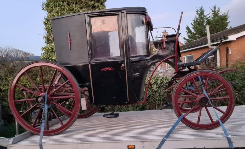 Glass fronted passenger carriage, an elegant traditional Brougham